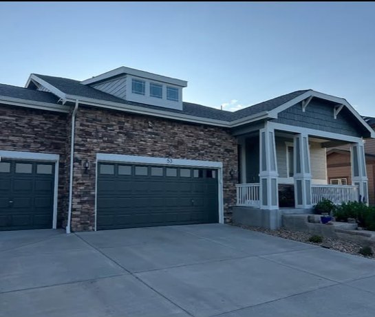 Craftsman home with stone accents, exterior painting complete