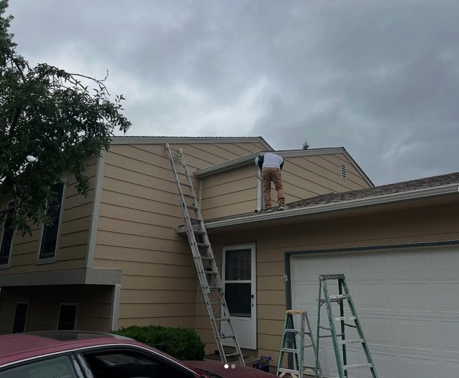Faded exterior siding before repaint, Denver home